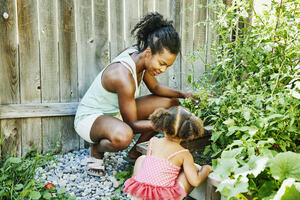 Mother and Daughter Gardening Together