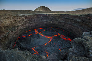 Lava landscape with a volcano